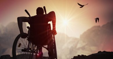 man-in-a-wheelchair-riding-toward-sun-rise-735x400-cb8e7382